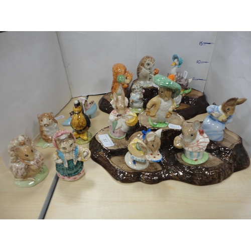 57 - Collection of Beswick Beatrix Potter figures on stands and others, loose.