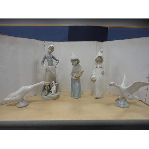 58 - Lladro figure group of a girl with geese, another Lladro figure, two Lladro geese figures and anothe... 