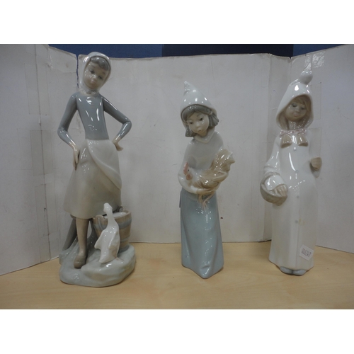 58 - Lladro figure group of a girl with geese, another Lladro figure, two Lladro geese figures and anothe... 
