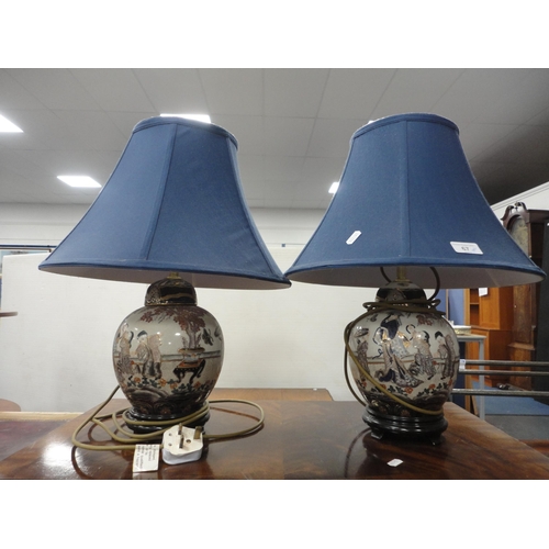 67 - Pair of reproduction Oriental crackle glaze table lamps on stands, with shades.