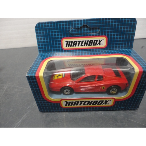 72 - Vanguard model of an Austin 7 Mini, boxed, a boxed Matchbox Ferrari Testarossa model, hand-painted B... 