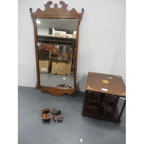 81 - Inlaid mahogany small revolving book table and an antique walnut scroll wall mirror.  (2)