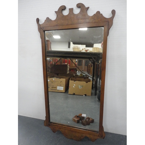 81 - Inlaid mahogany small revolving book table and an antique walnut scroll wall mirror.  (2)