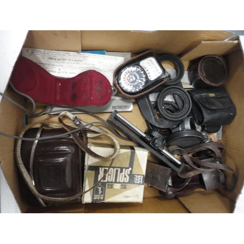 86 - Two cartons containing cameras, modern mantel clock, binoculars, accessories, light meters, instrume... 
