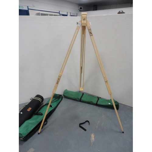 90 - Two folding wooden easels and a camera tripod, all in carry bags.  (3)