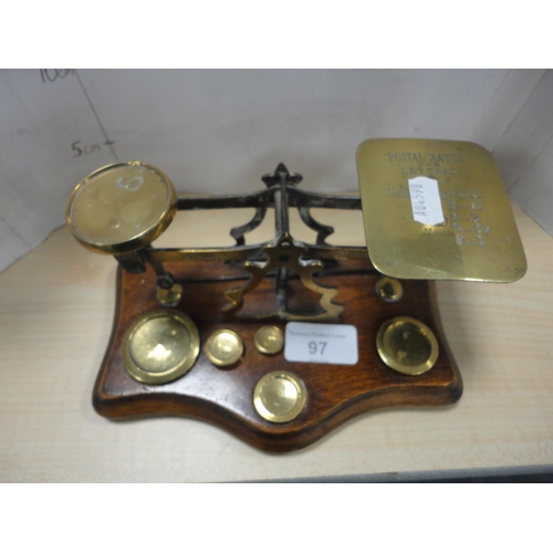 97 - Set of oak and brass postal scales with weights.