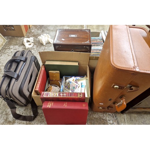 640 - Large assortment of stamps in albums and loose, a wooden box, vintage trunk, and a laptop/work bag