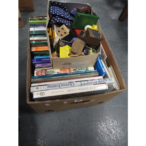 84A - Carton containing various books on gardening, home-making etc., and a small box of dolls house furni... 