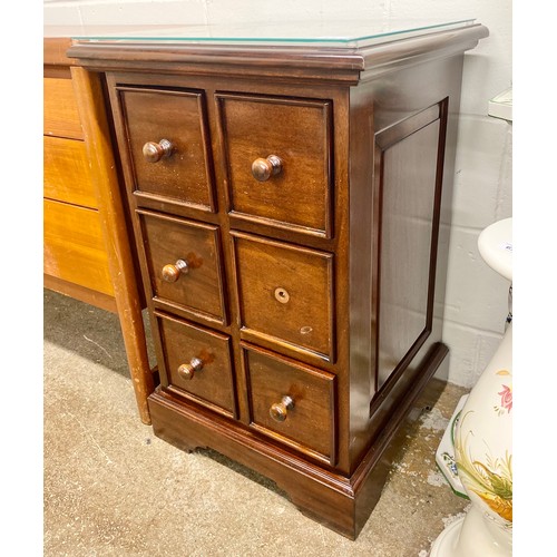 676 - Mahogany six drawer unit with glass protector