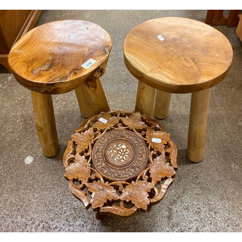 670 - Two rustic look milking stools and an ornately carved stool with mother of pearl inlay