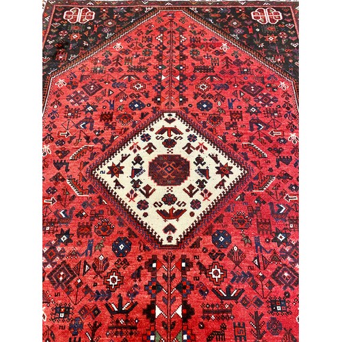 656 - Large red ground woollen rug