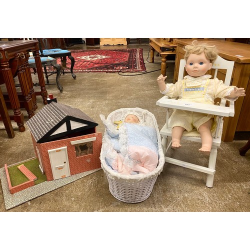 653 - Two vintage ceramic dolls with high chair and basket, and a hand made dolls house