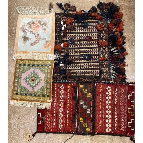 648 - Two miniature rugs and two woven bags