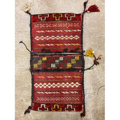 648 - Two miniature rugs and two woven bags