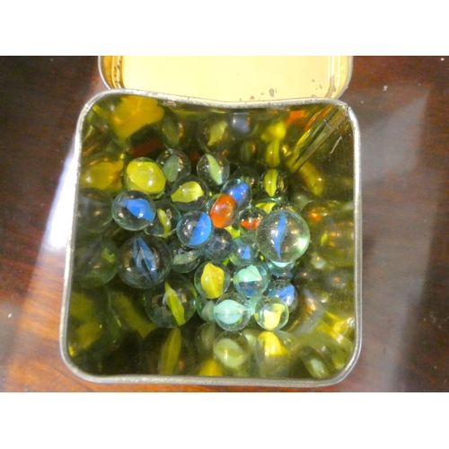 334 - Small tin of vintage marbles.