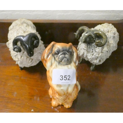 352 - Beswick Pekingese and two studio pottery models of sheep. a/f