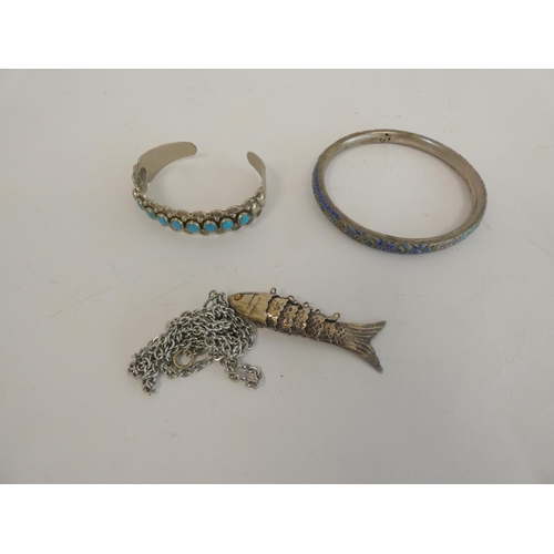 375 - Silver nickel bangle, enamelled bangle and white metal fish.