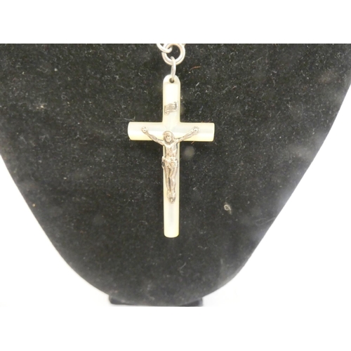 376 - Silver and mother of pearl crucifix on silver belcher chain.