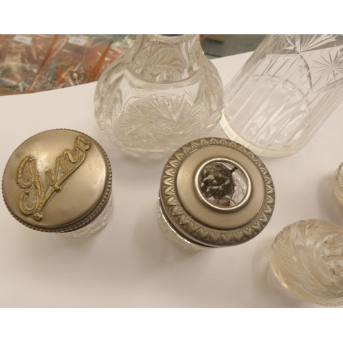 387 - Various cut glass bottles and pots.