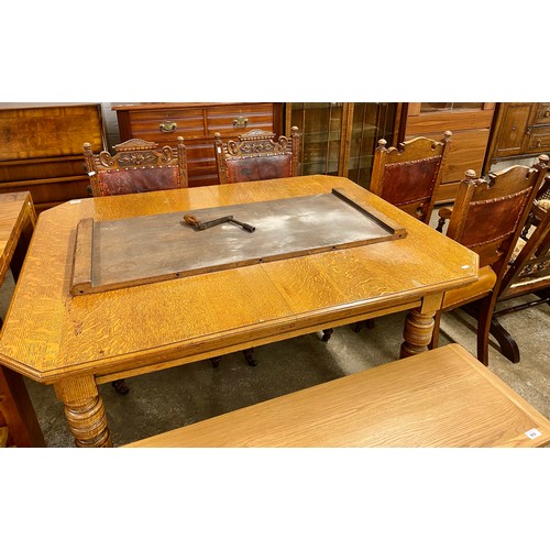 630 - Oak telescope table with single leaf & four dining chairs.