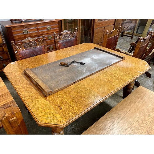 630 - Oak telescope table with single leaf & four dining chairs.