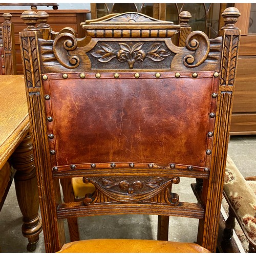 630 - Oak telescope table with single leaf & four dining chairs.