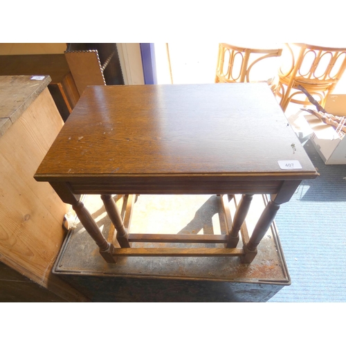 407 - Modern oak nest of two side tables.