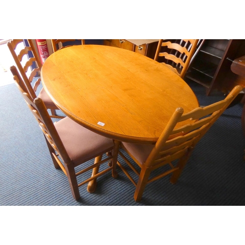 417 - Oval pedestal dining table with five ladder back chairs.