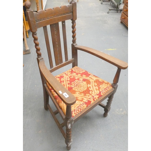 446 - 20th century oak elbow chair.