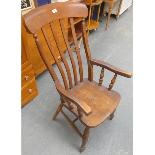 447 - Elm antique country style chair on turned legs with a stretcher.