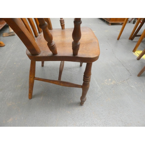 447 - Elm antique country style chair on turned legs with a stretcher.