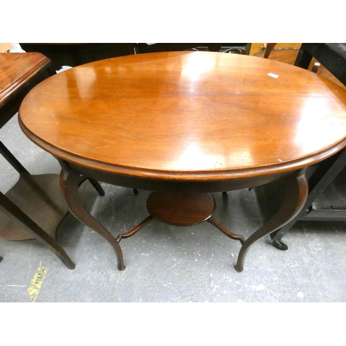 462 - Oval mahogany two tier side table.