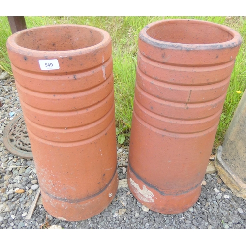 549 - Pair of modern terracotta chimney pots. Height 59cm x Width 26cm.