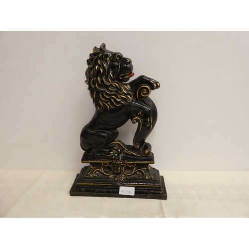 454 - Large cast iron door stop in a form of a lion rampant.