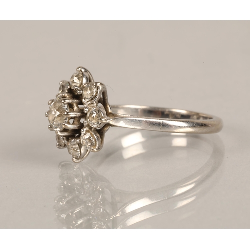 138 - Ladies daisy cluster ring, central stone , central stone 0.5 carat surrounded by eight small stones ... 