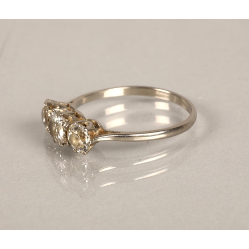 139 - White metal ring set with a trio of diamonds, central stone 0.5 carat with o.33 carat at either side... 