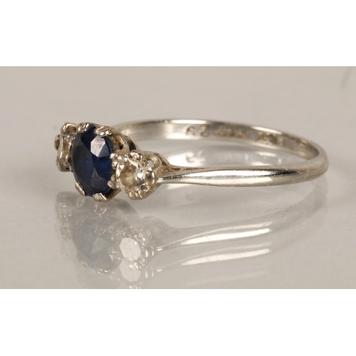 134 - 18K white gold and platinum ring set with a blue gem flanked by two diamonds, ring size S, 3g