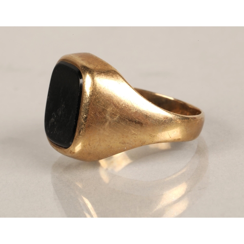 66 - 9ct gold signet set with a black gem, ring size P, 4.1g