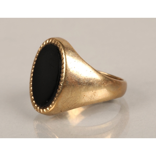 71 - 9ct gold signet ring set with black stone, ring size R, 8.3g