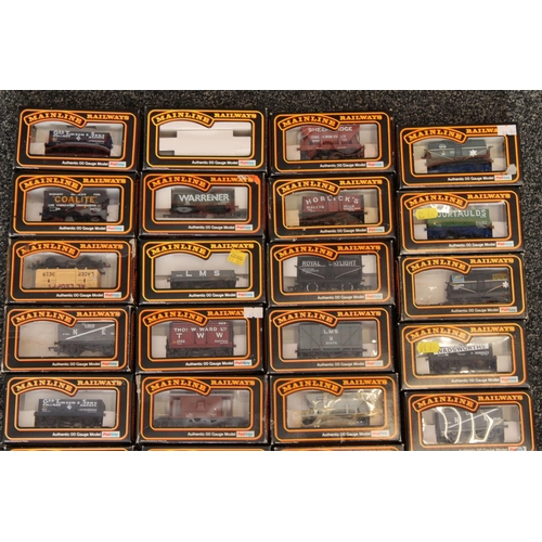 1061 - Thirty Mainline OO gauge model railways rolling stock wagons and vans to include 37174 fruit van GWR...