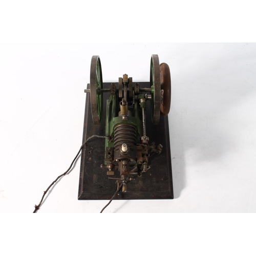 1093 - Cast metal model of a static engine, raised on wooden plinth, 27cm long.