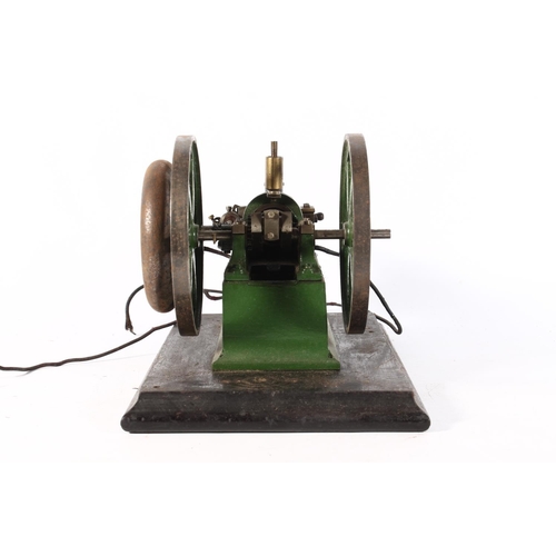 1093 - Cast metal model of a static engine, raised on wooden plinth, 27cm long.