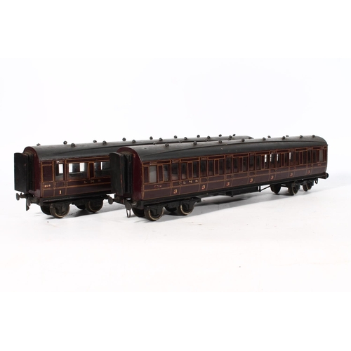 1117 - Four wood built O gauge model railway LMS carriages to include first class coach, third class coach,... 