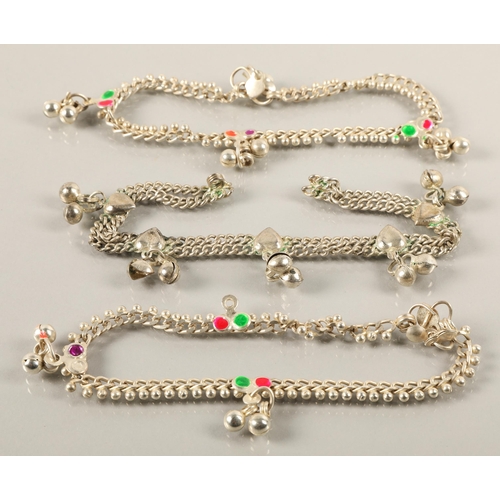 80 - Three white metal anklets