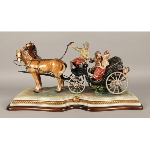 42 - Large Capodimonte figure of couple being pulled in horse-drawn carriage, approx. 67cm x 30cm x 37cm