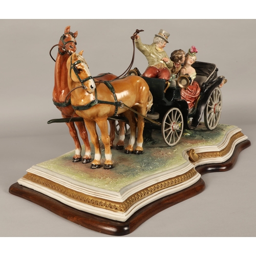 42 - Large Capodimonte figure of couple being pulled in horse-drawn carriage, approx. 67cm x 30cm x 37cm