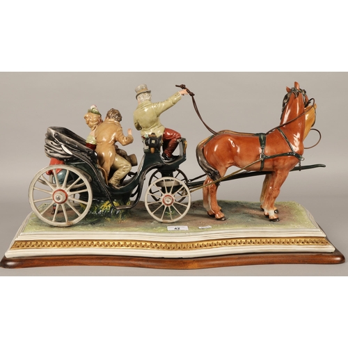 42 - Large Capodimonte figure of couple being pulled in horse-drawn carriage, approx. 67cm x 30cm x 37cm