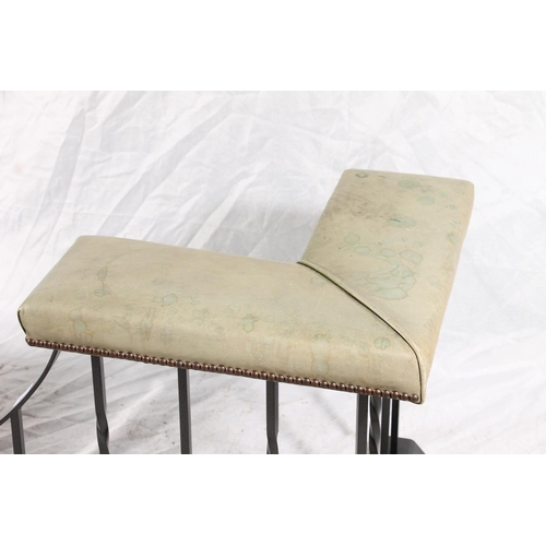 371 - 20thC japanned metal and leather club fender, the green padded seats on shaped frame, W181cm.