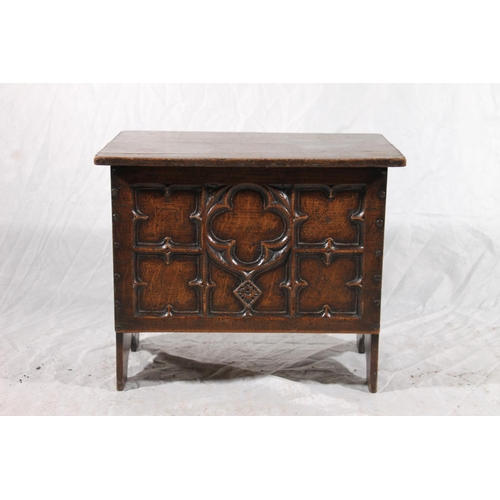 382 - Small oak coffer chest, the front panel deep carved in the gothic fashion, plain plank sides and hin... 