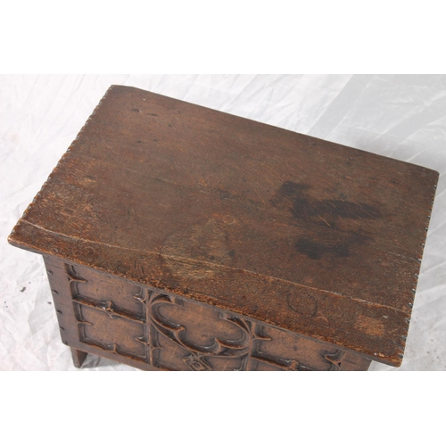 382 - Small oak coffer chest, the front panel deep carved in the gothic fashion, plain plank sides and hin... 